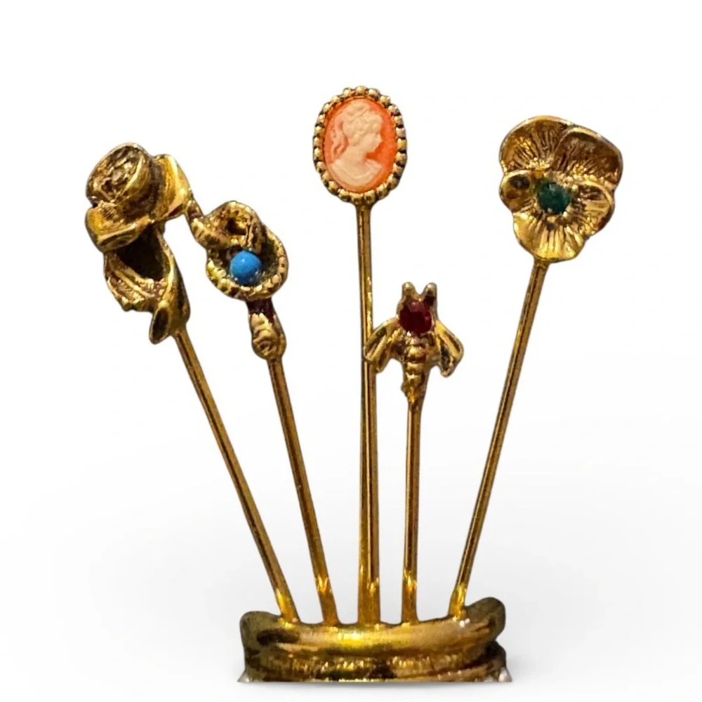 Vintage gold-plated thimble brooch with five stick pins.
